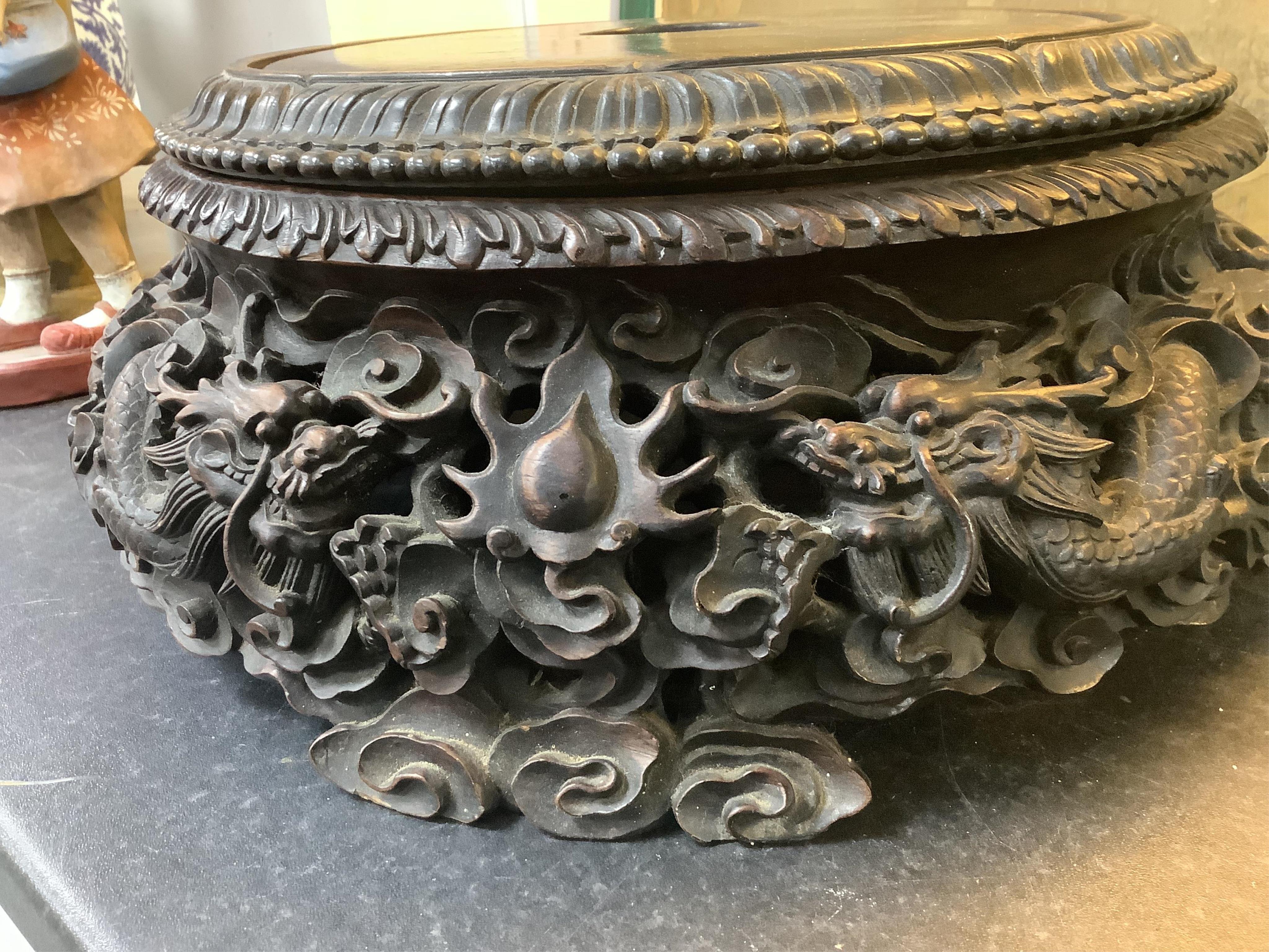 An impressive Chinese hongmu ‘dragon’ stand, late 19th century